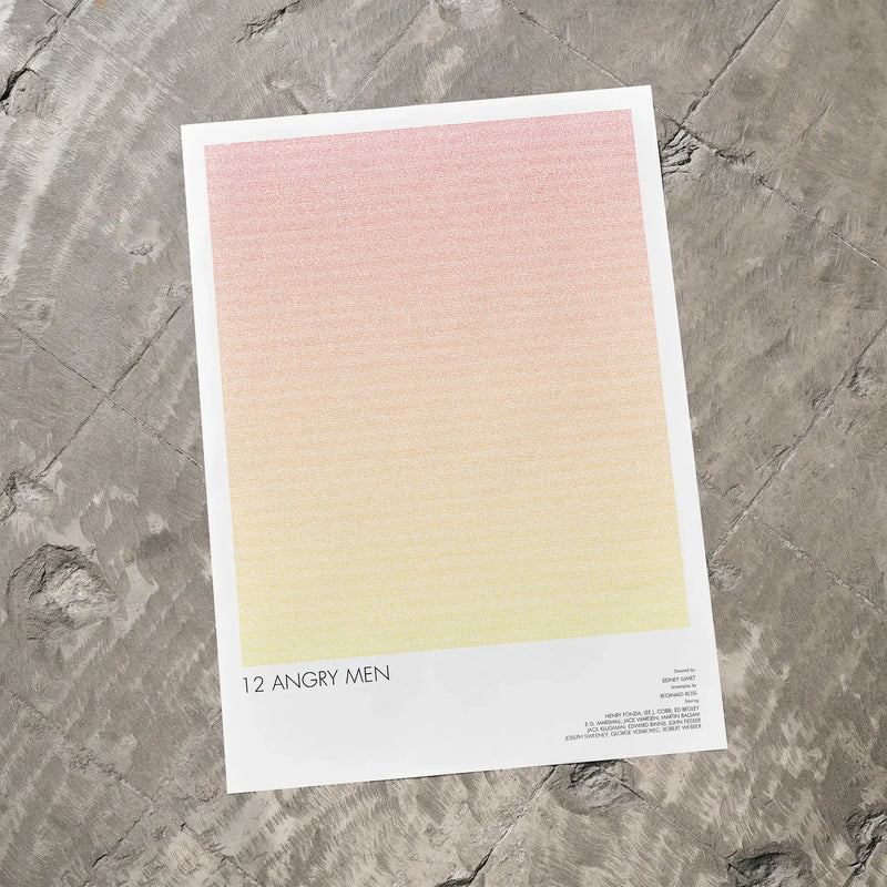 A 12 Angry Men movie script poster laid flat on a textured floor surface.