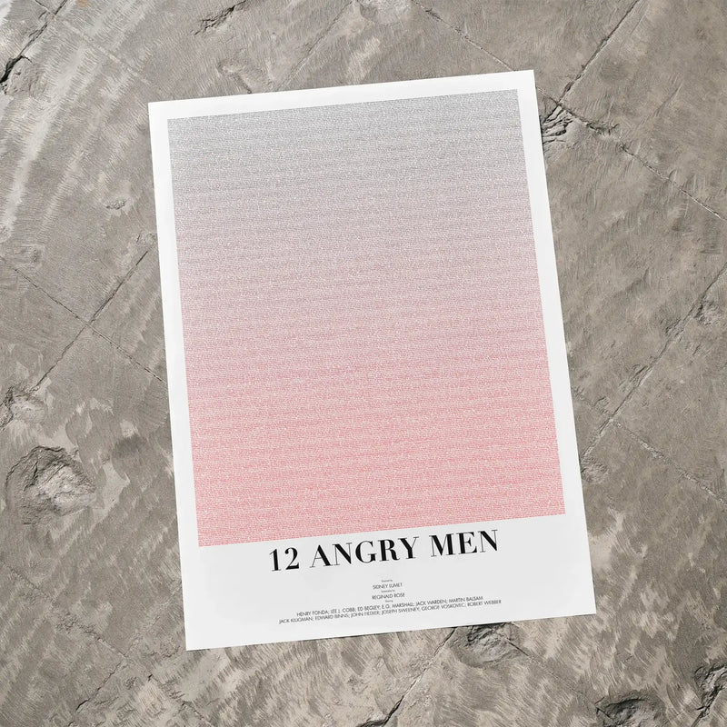 A 12 Angry Men movie script poster laid flat on a textured floor surface.