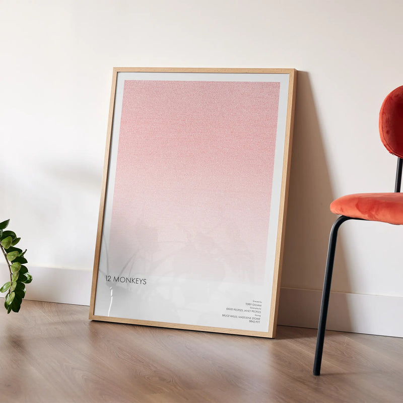 A framed 12 Monkeys movie script poster placed in a bright interior environment.