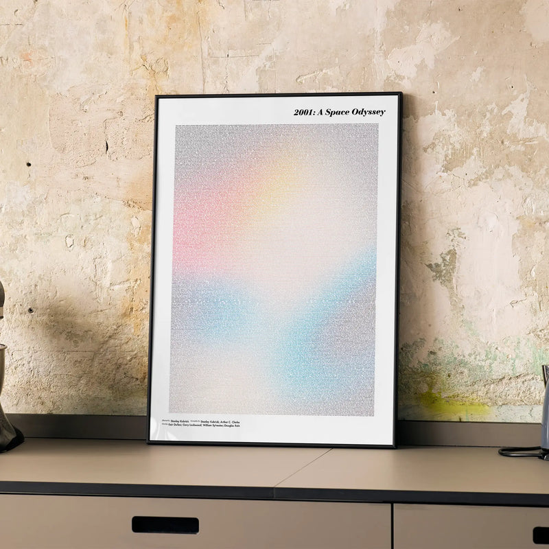 A framed 2001: A Space Odyssey movie script poster displayed on a cabinet in a minimalist interior.