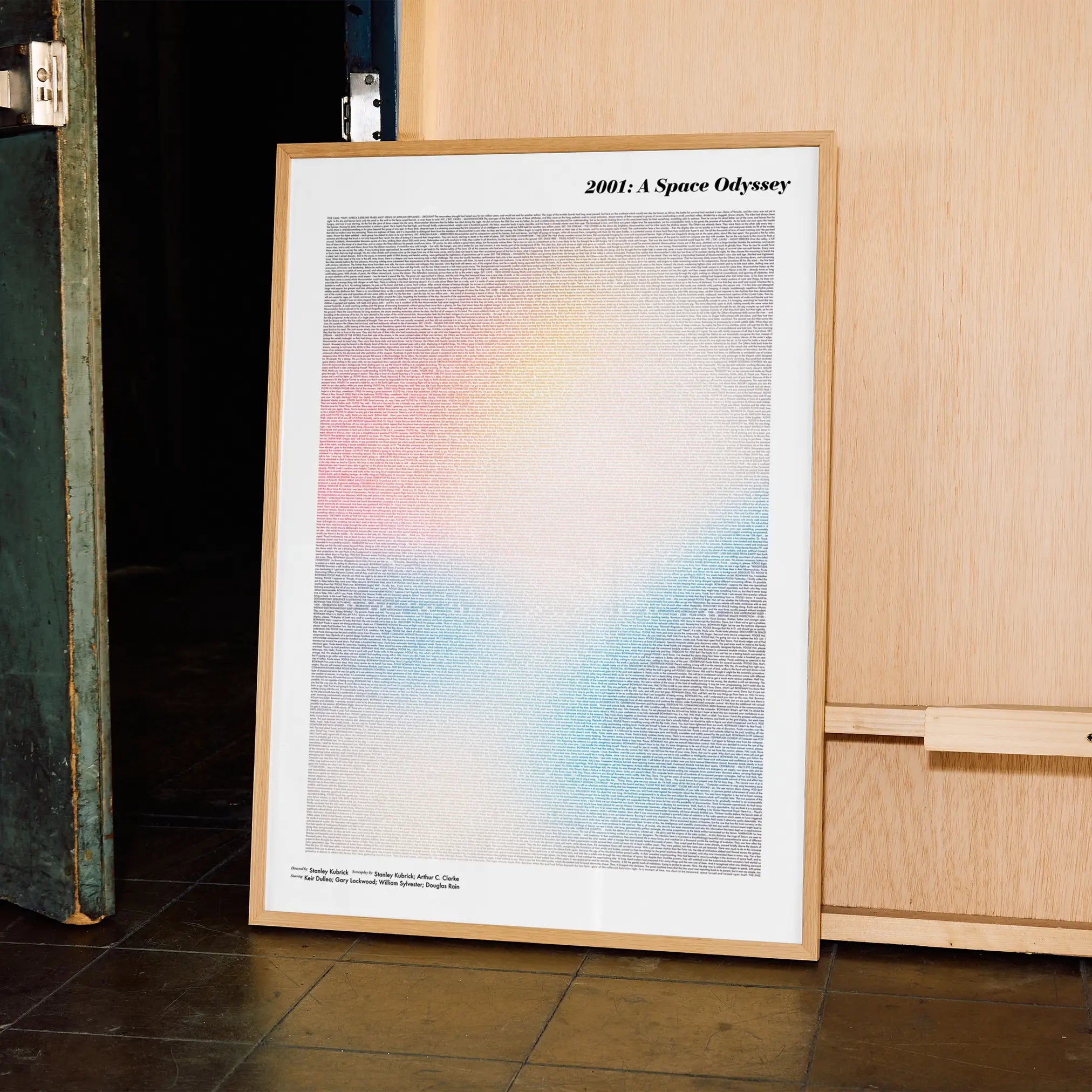 A framed 2001: A Space Odyssey movie script poster displayed in a contemporary interior setting.