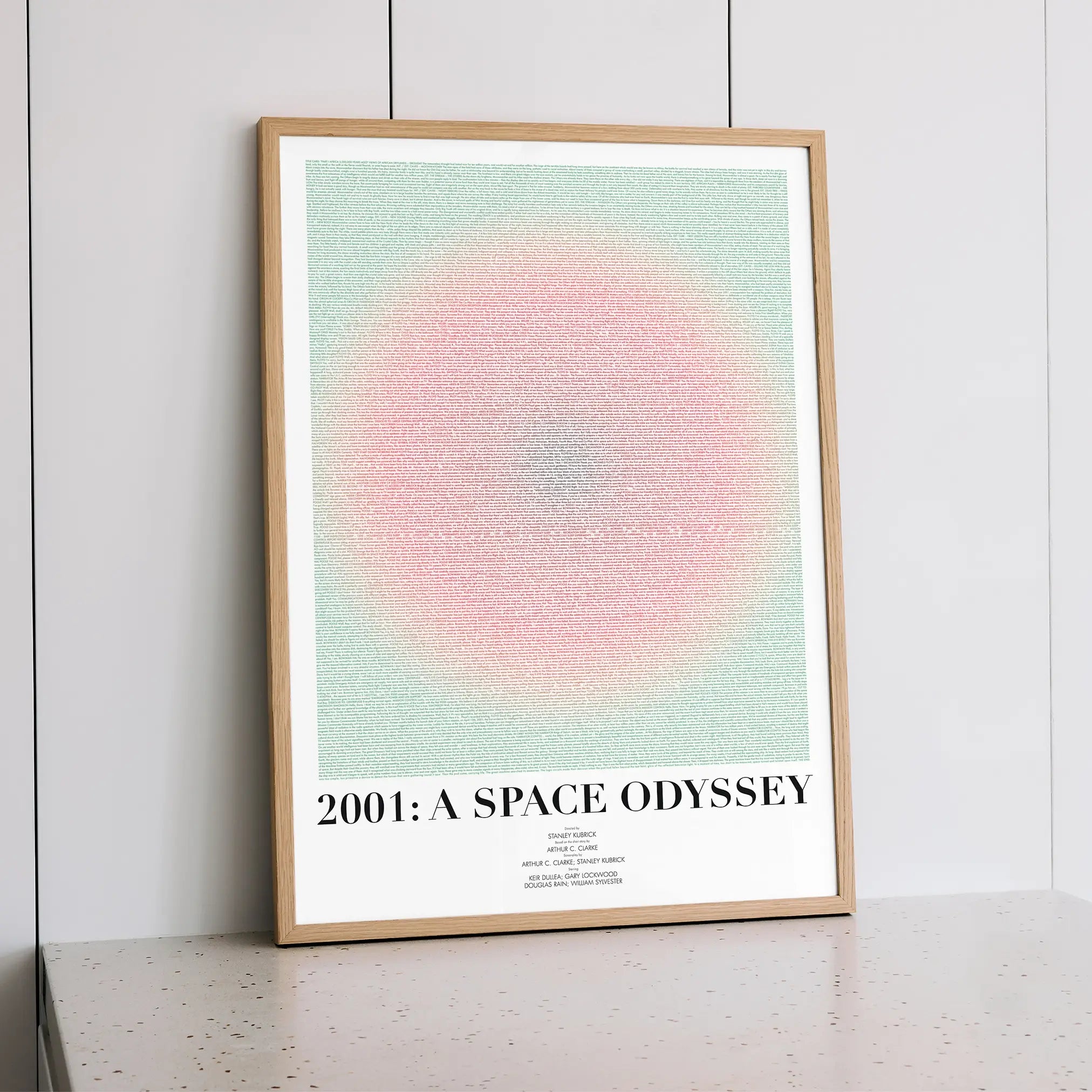 A framed 2001: A Space Odyssey movie script poster styled within a calm interior space.