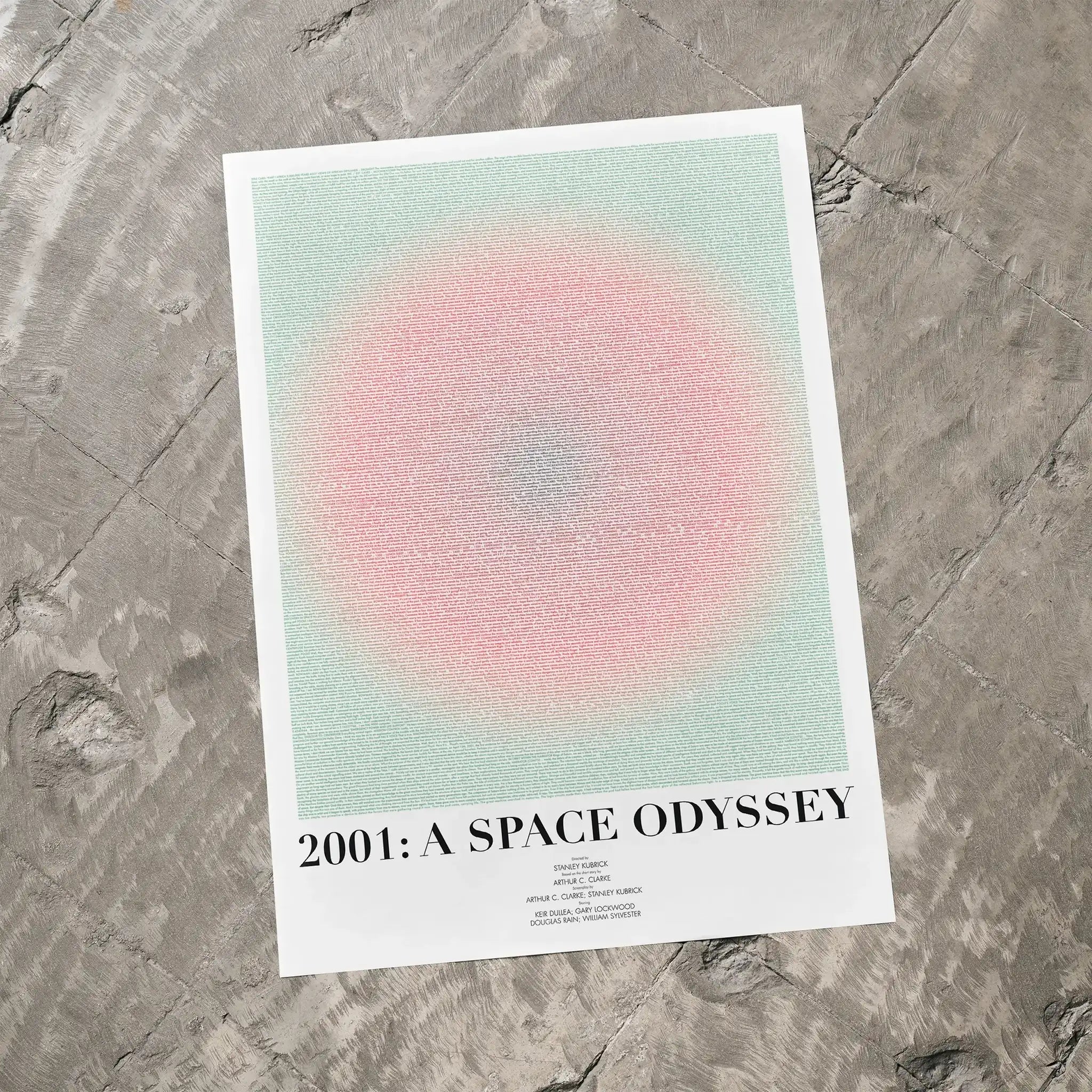 A 2001: A Space Odyssey movie script poster laid flat on a textured floor surface.