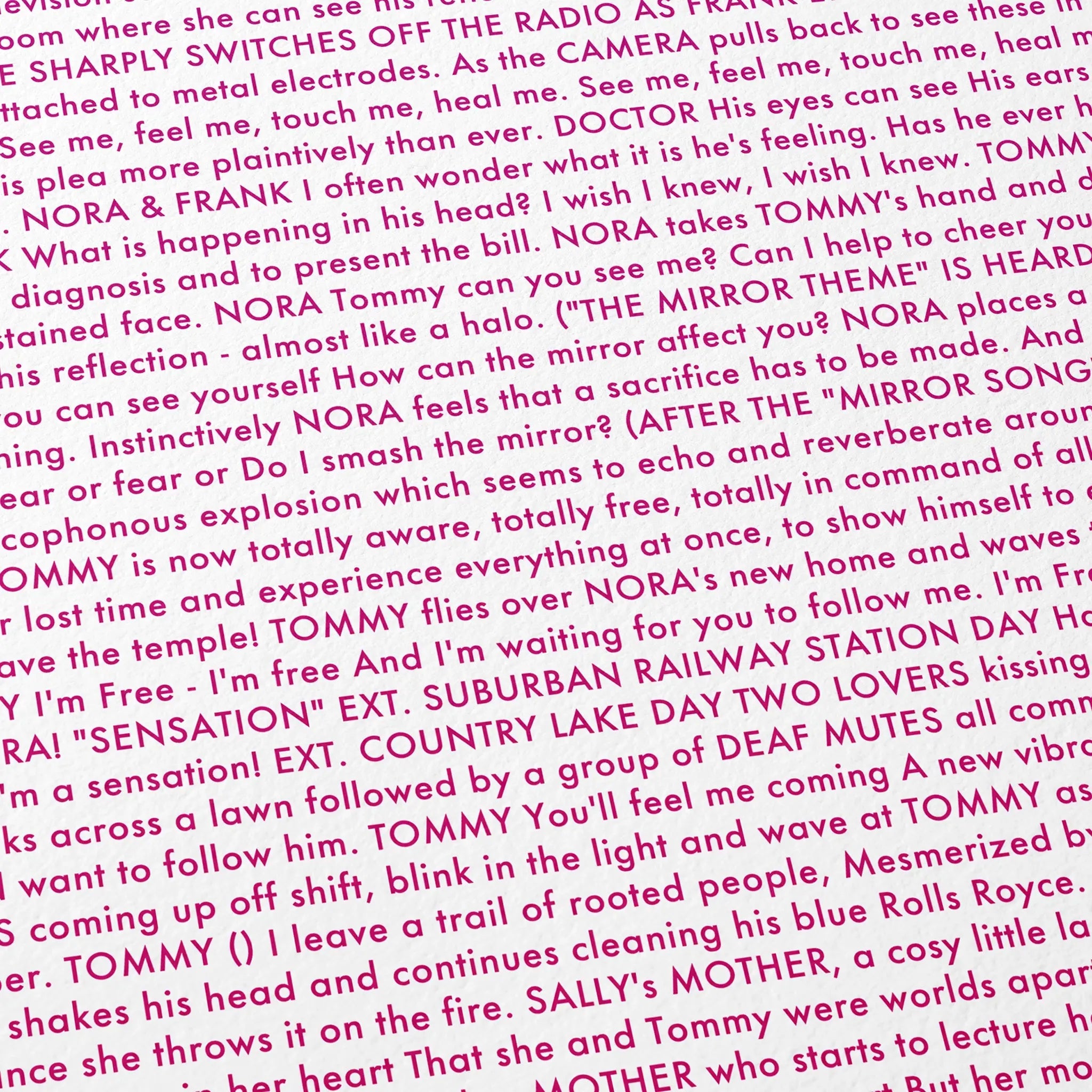 Close-up detail of the Tommy movie script poster showing dense typographic text.