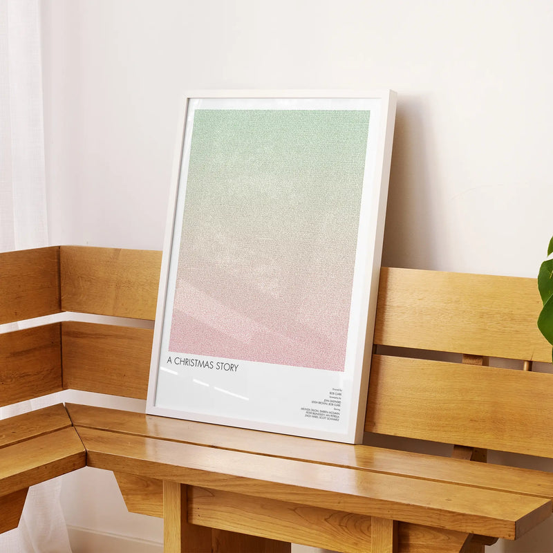 A framed A Christmas Story movie script poster displayed on a sideboard in a contemporary space.
