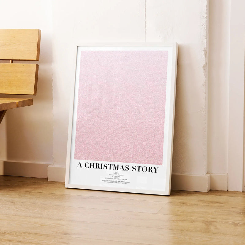 A framed A Christmas Story movie script poster leaning against a wall in a modern interior.