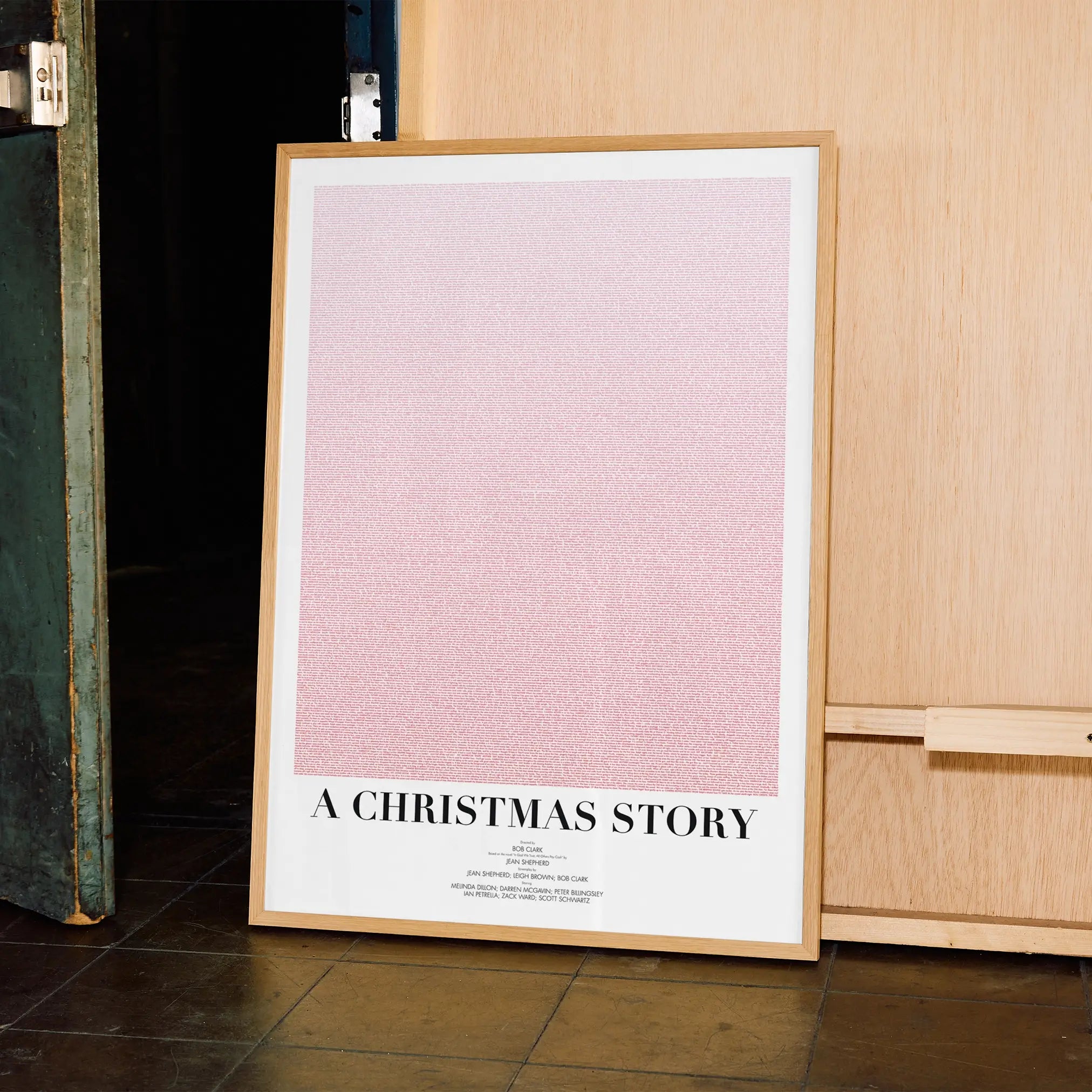 A framed A Christmas Story movie script poster displayed in a contemporary interior setting.