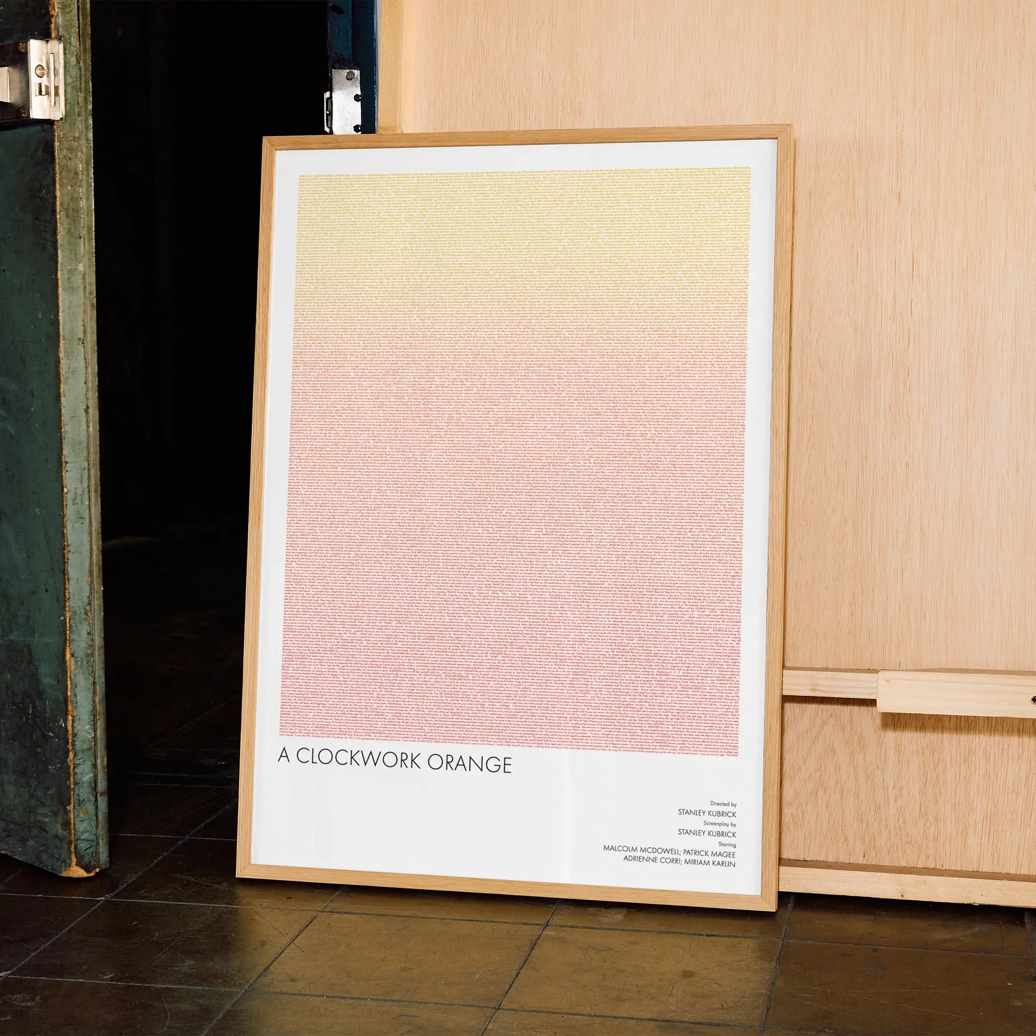A framed A Clockwork Orange movie script poster displayed in a contemporary interior setting.