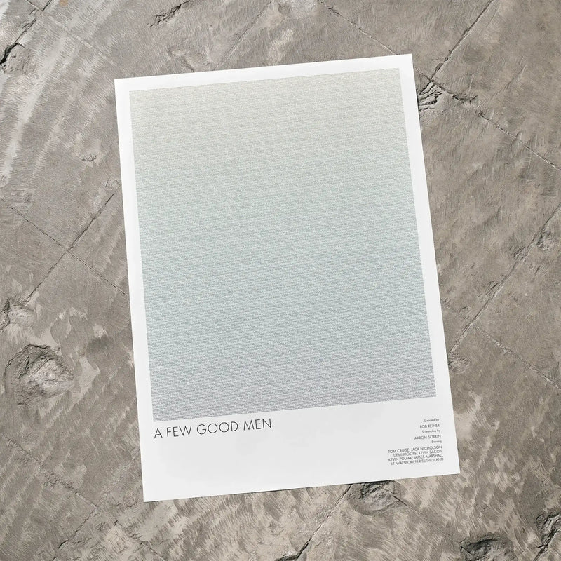 A A Few Good Men movie script poster laid flat on a textured floor surface.