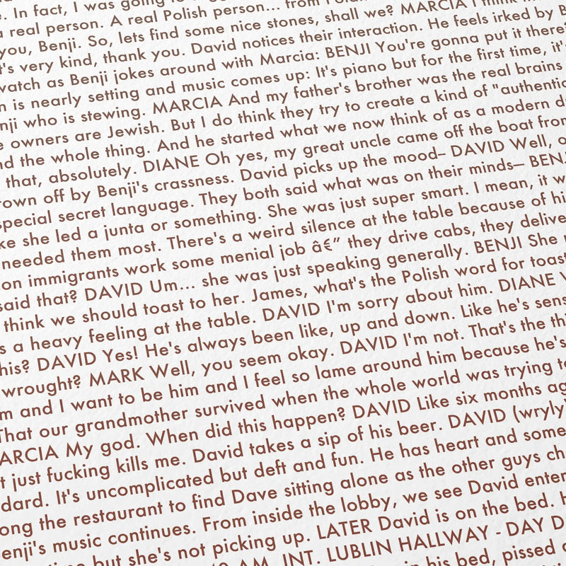 Close-up detail of the A Real Pain movie script poster showing dense typographic text.