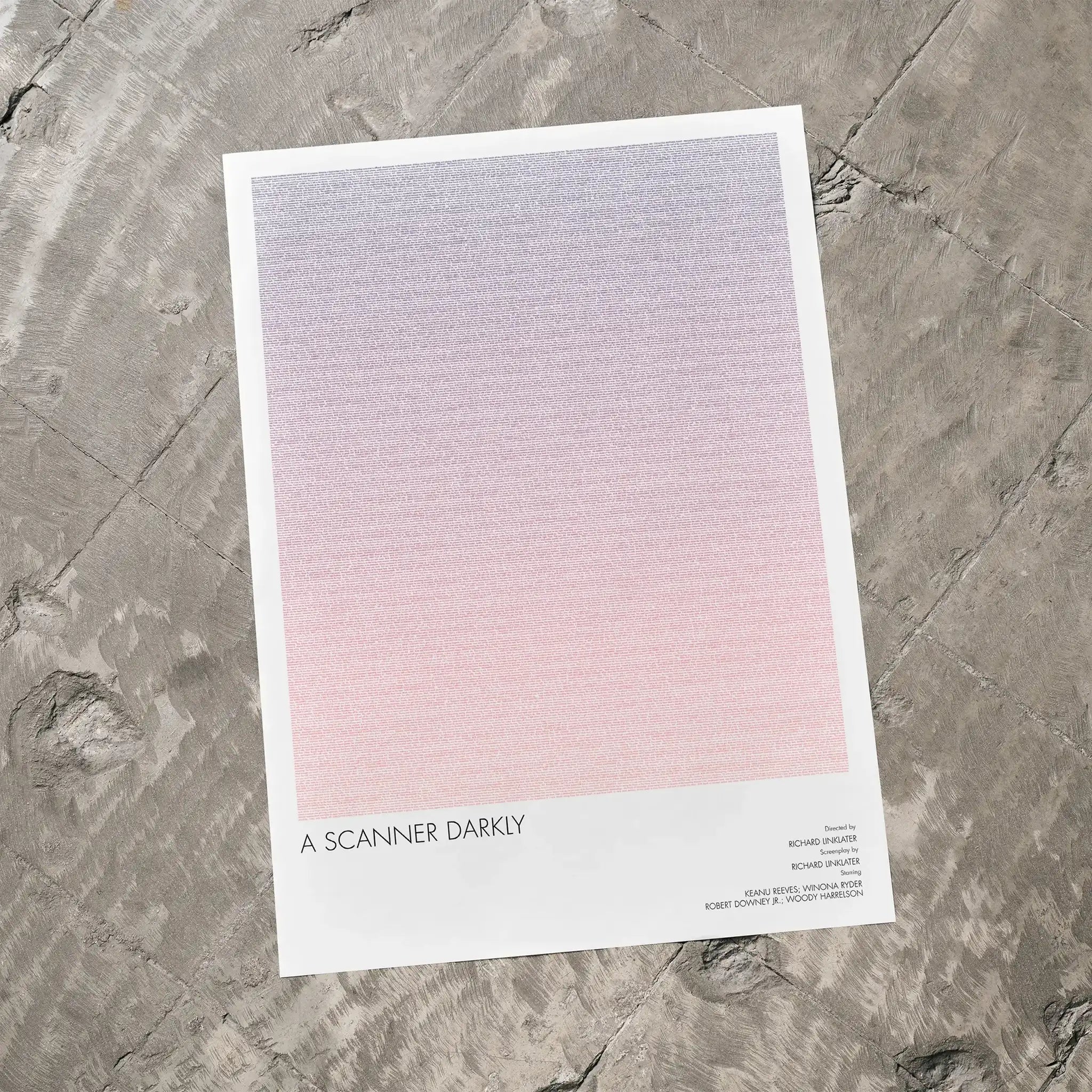 A A Scanner Darkly movie script poster laid flat on a textured floor surface.