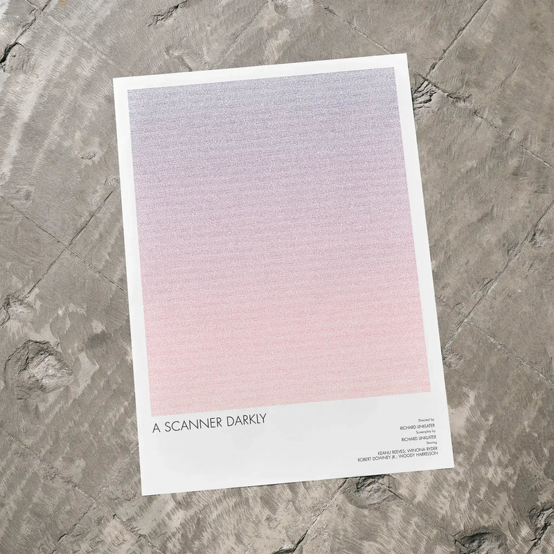A A Scanner Darkly movie script poster laid flat on a textured floor surface.
