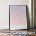 A framed A Scanner Darkly movie script poster leaning against a wall in a minimalist interior.