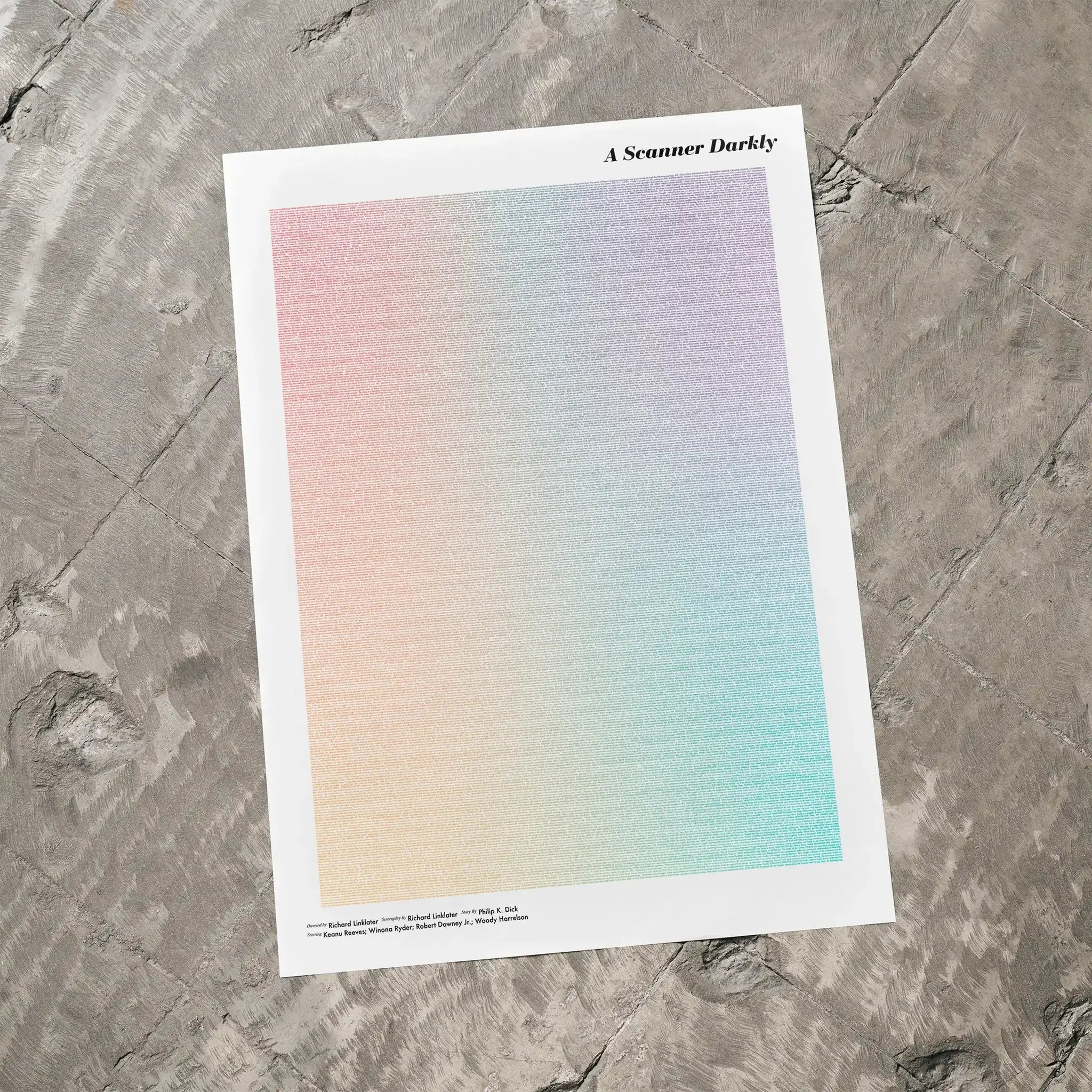 A A Scanner Darkly movie script poster laid flat on a textured floor surface.