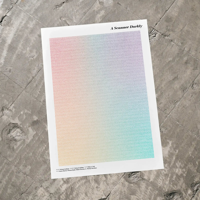 A A Scanner Darkly movie script poster laid flat on a textured floor surface.
