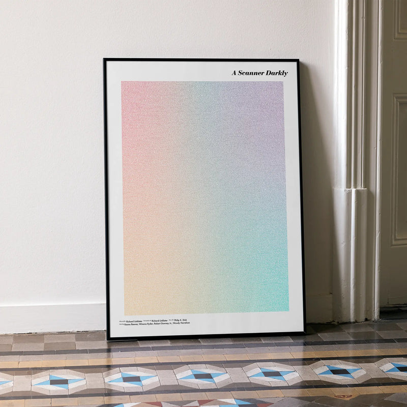 A framed A Scanner Darkly movie script poster leaning against a wall in a minimalist interior.