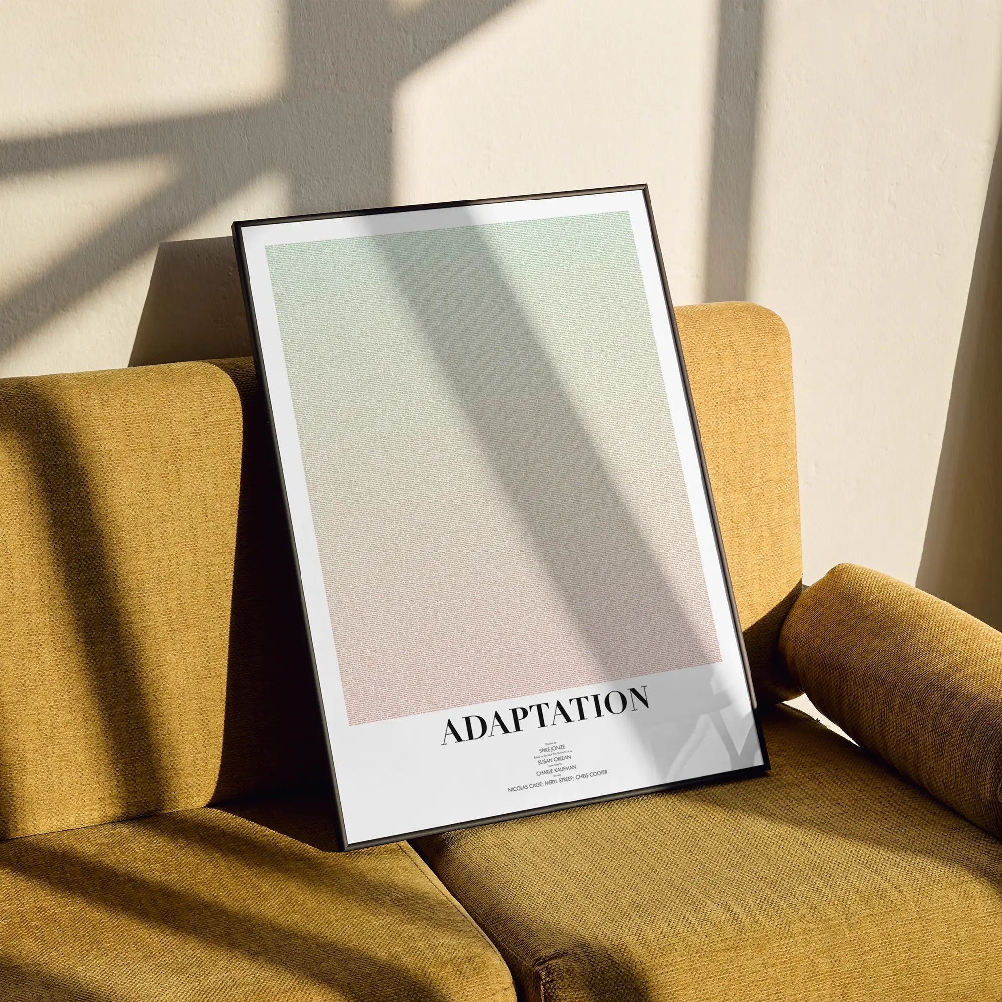 A framed Adaptation. movie script poster styled in a clean interior setting.