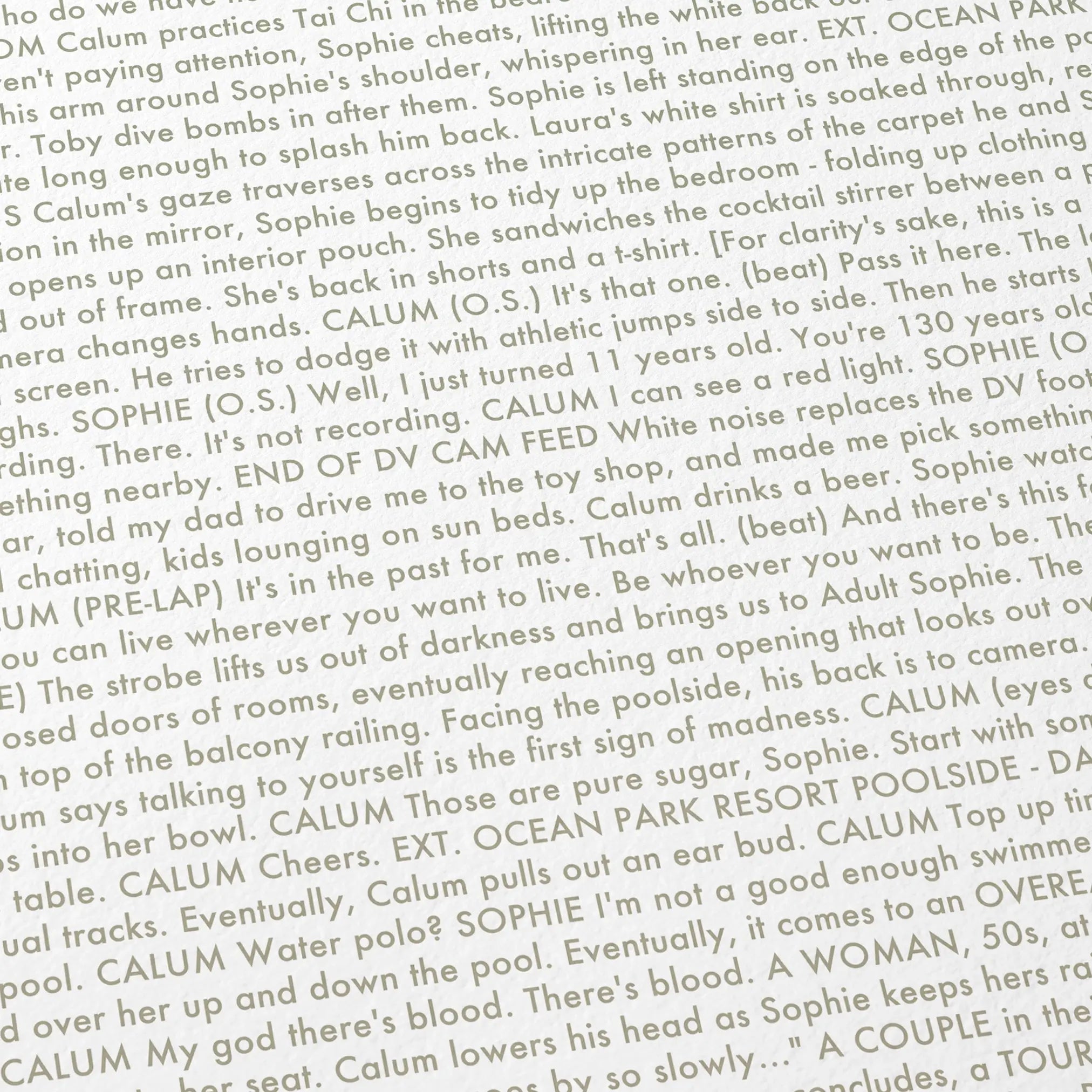 Close-up detail of the Aftersun movie script poster showing dense typographic text.