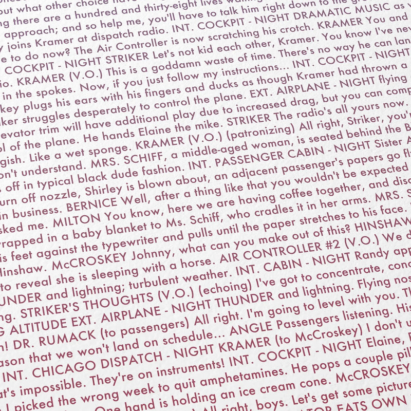 Close-up detail of the Airplane movie script poster showing dense typographic text.