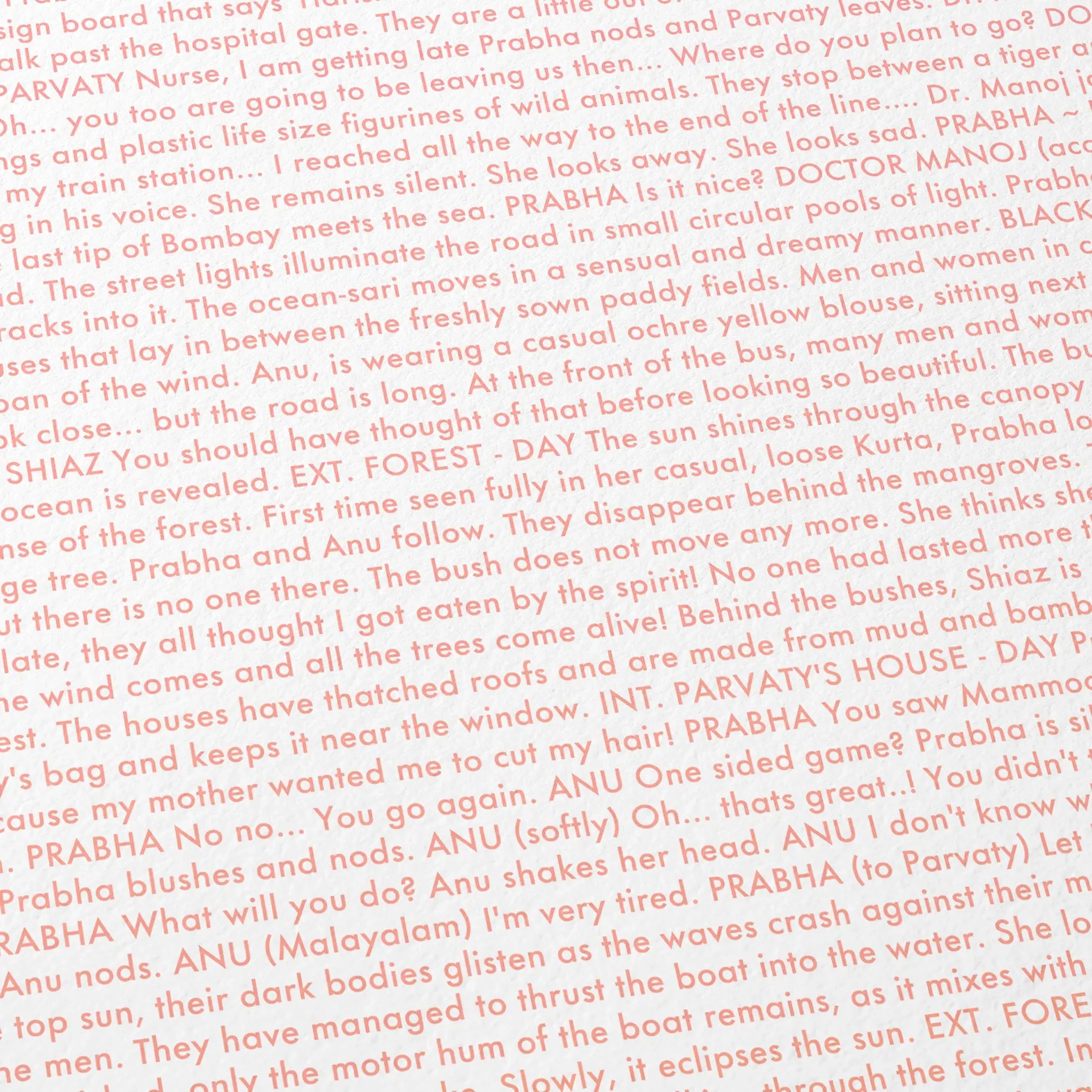 Close-up detail of the All We Imagine as Light movie script poster showing dense typographic text.