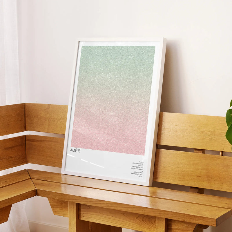 A framed Amélie movie script poster displayed on a sideboard in a contemporary space.