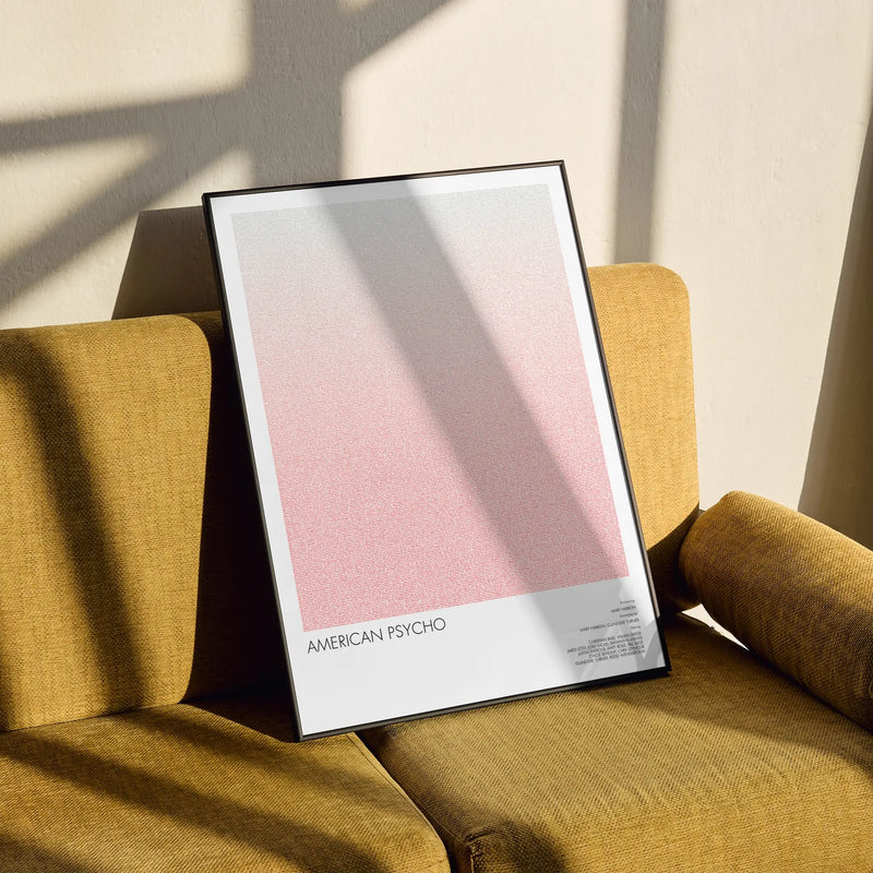 A framed American Psycho movie script poster styled in a clean interior setting.