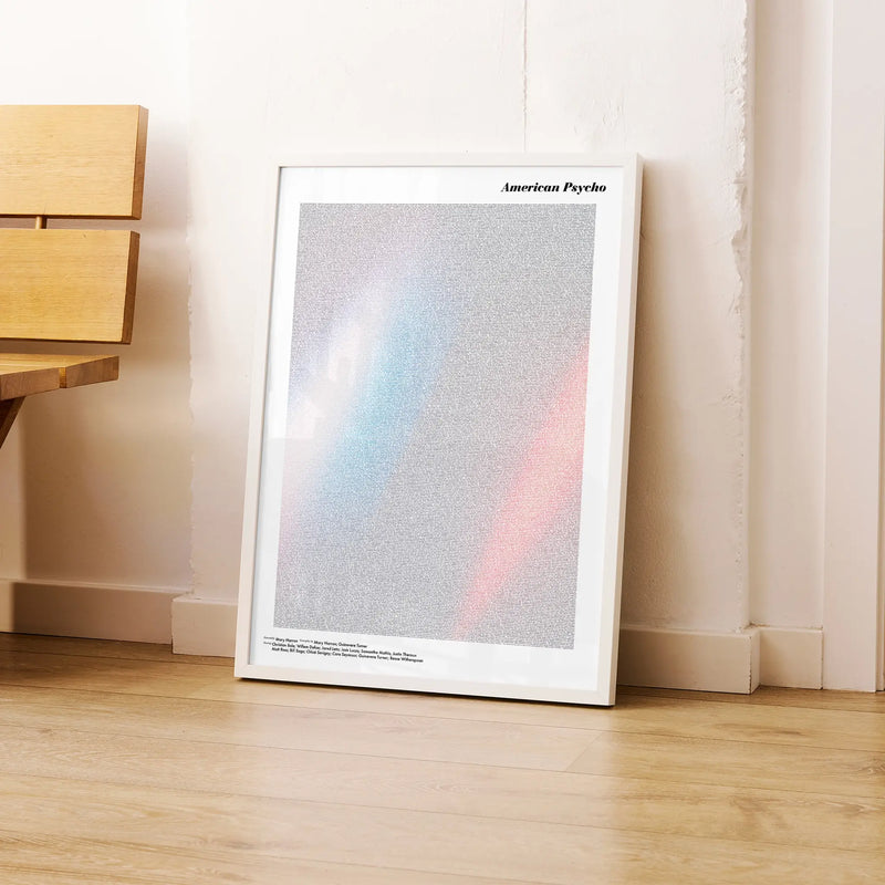 A framed American Psycho movie script poster leaning against a wall in a modern interior.