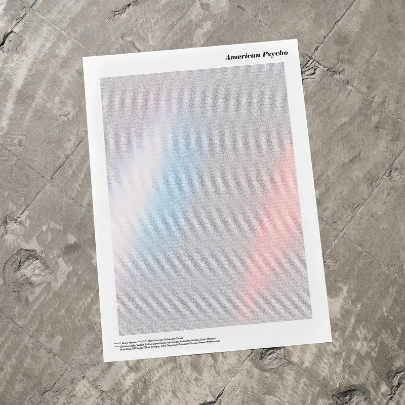 A American Psycho movie script poster laid flat on a textured floor surface.