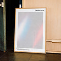 A framed American Psycho movie script poster displayed in a contemporary interior setting.