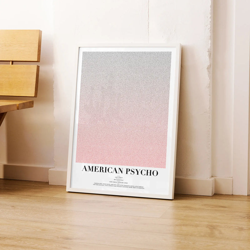 A framed American Psycho movie script poster leaning against a wall in a modern interior.
