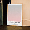 A framed American Psycho movie script poster displayed in a contemporary interior setting.