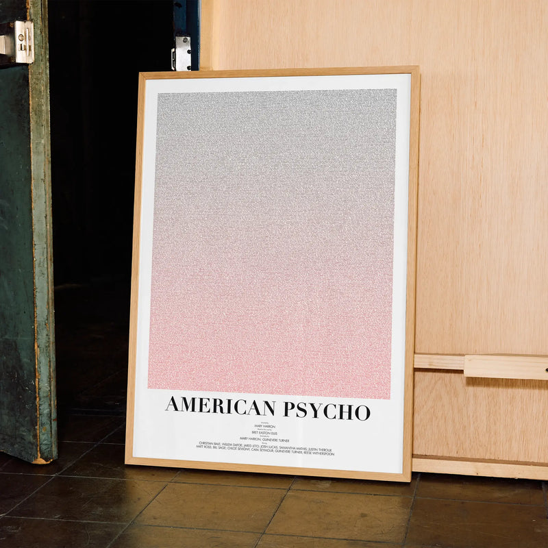 A framed American Psycho movie script poster displayed in a contemporary interior setting.