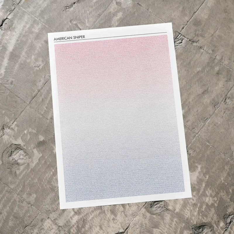 A American Sniper movie script poster laid flat on a textured floor surface.