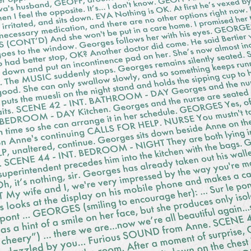 Close-up detail of the Amour movie script poster showing dense typographic text.