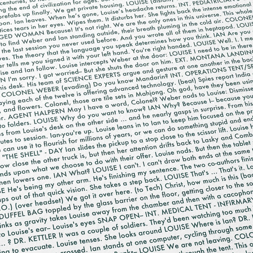 Close-up detail of the Arrival movie script poster showing dense typographic text.