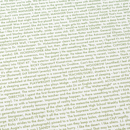 Close-up detail of the Asteroid City movie script poster showing dense typographic text.