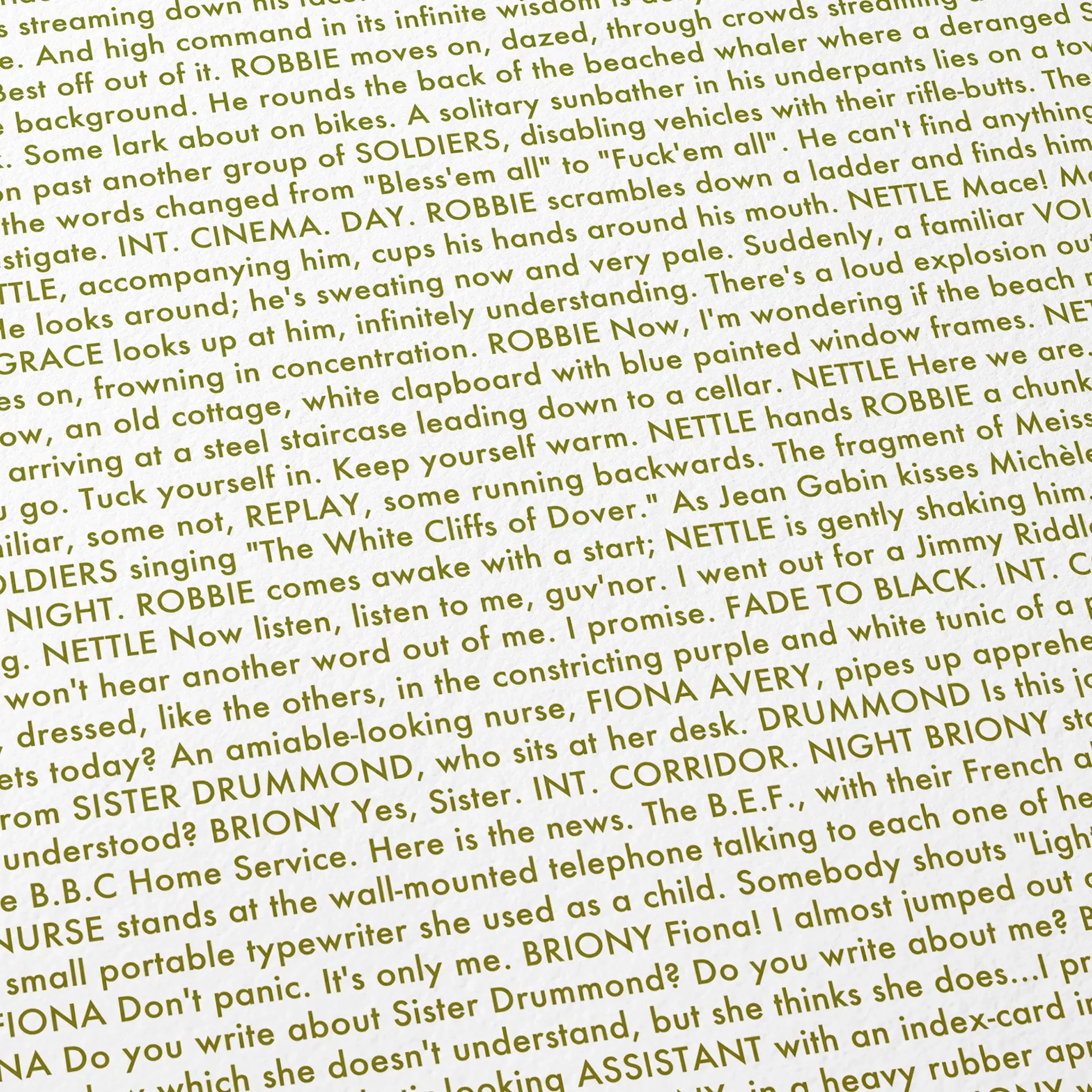 Close-up detail of the Atonement movie script poster showing dense typographic text.