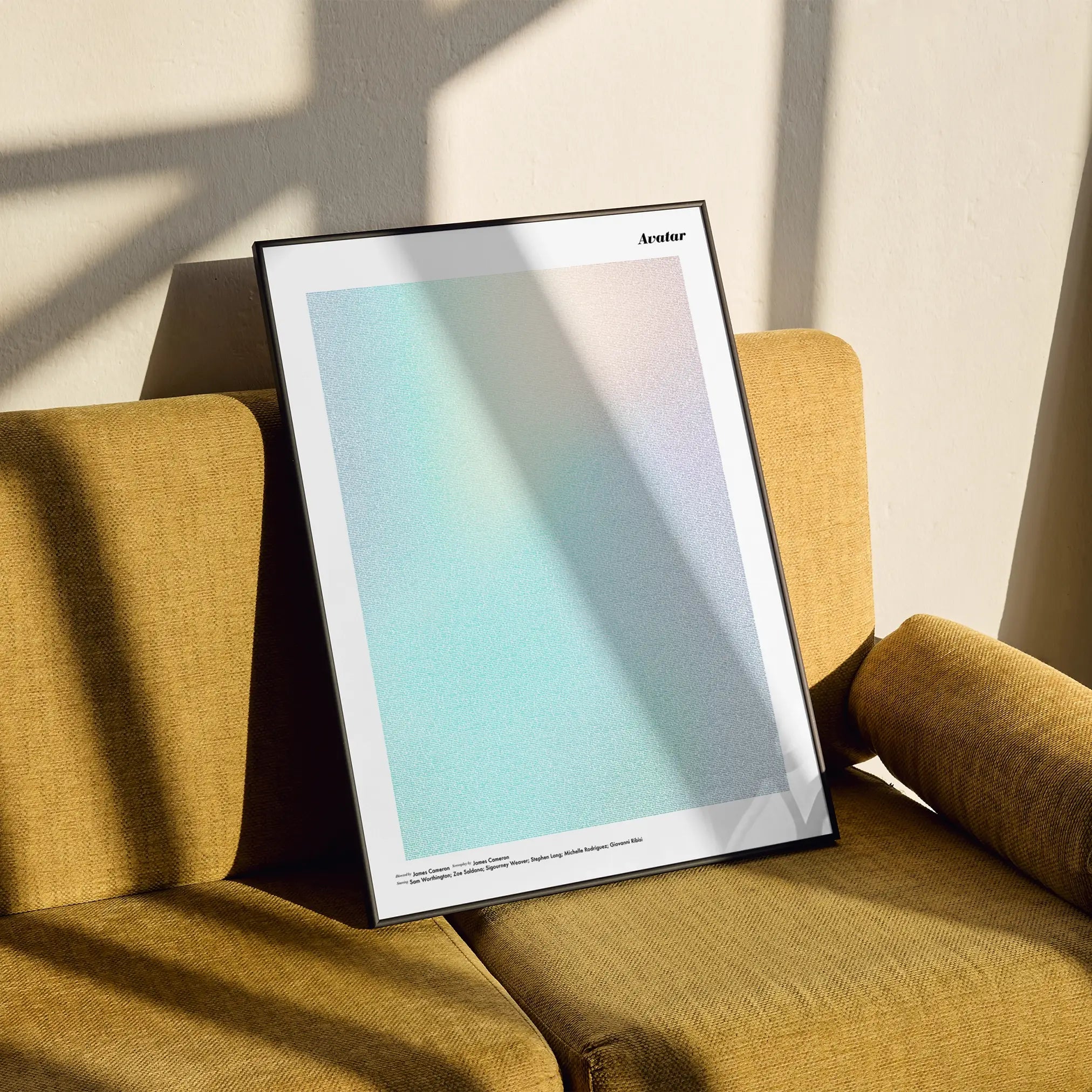 A framed Avatar movie script poster styled in a clean interior setting.