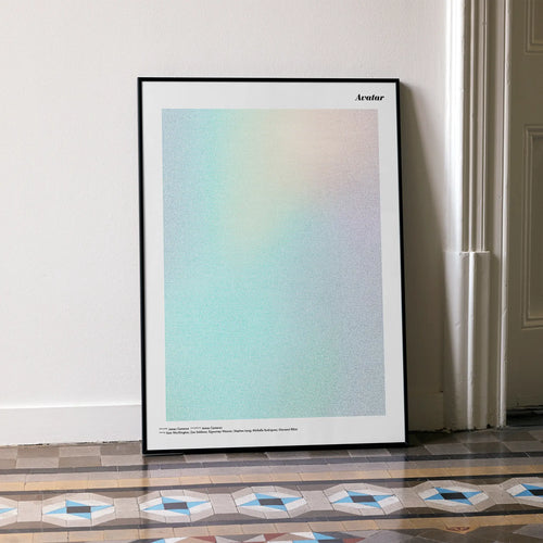 A framed Avatar movie script poster leaning against a wall in a minimalist interior.