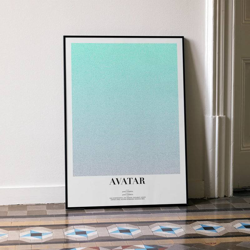 A framed Avatar movie script poster leaning against a wall in a minimalist interior.