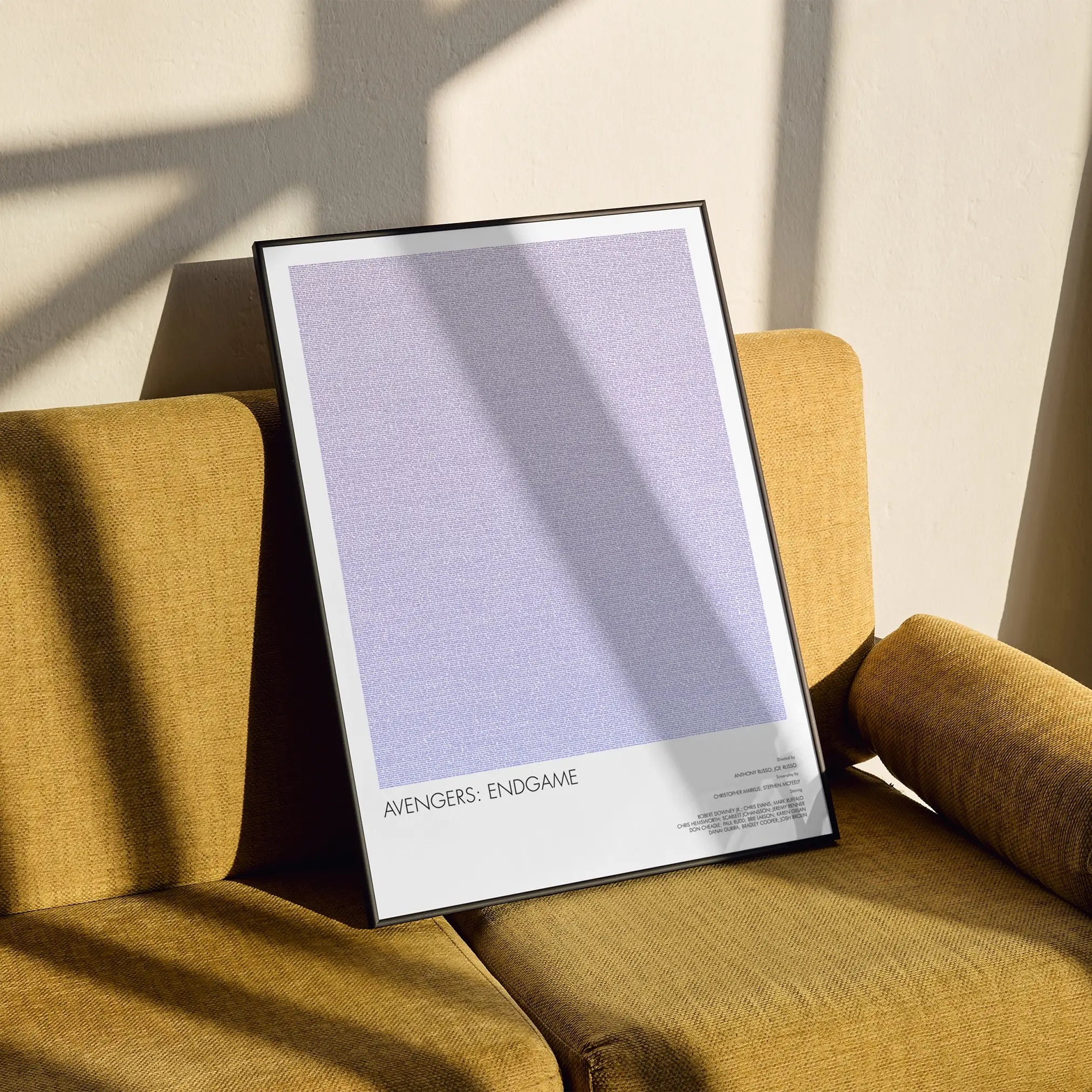 A framed Avengers: Endgame movie script poster styled in a clean interior setting.