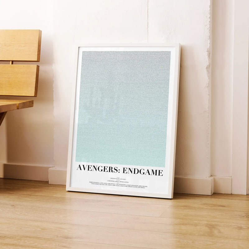 A framed Avengers: Endgame movie script poster leaning against a wall in a modern interior.
