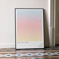 A framed Back to the Future movie script poster leaning against a wall in a minimalist interior.