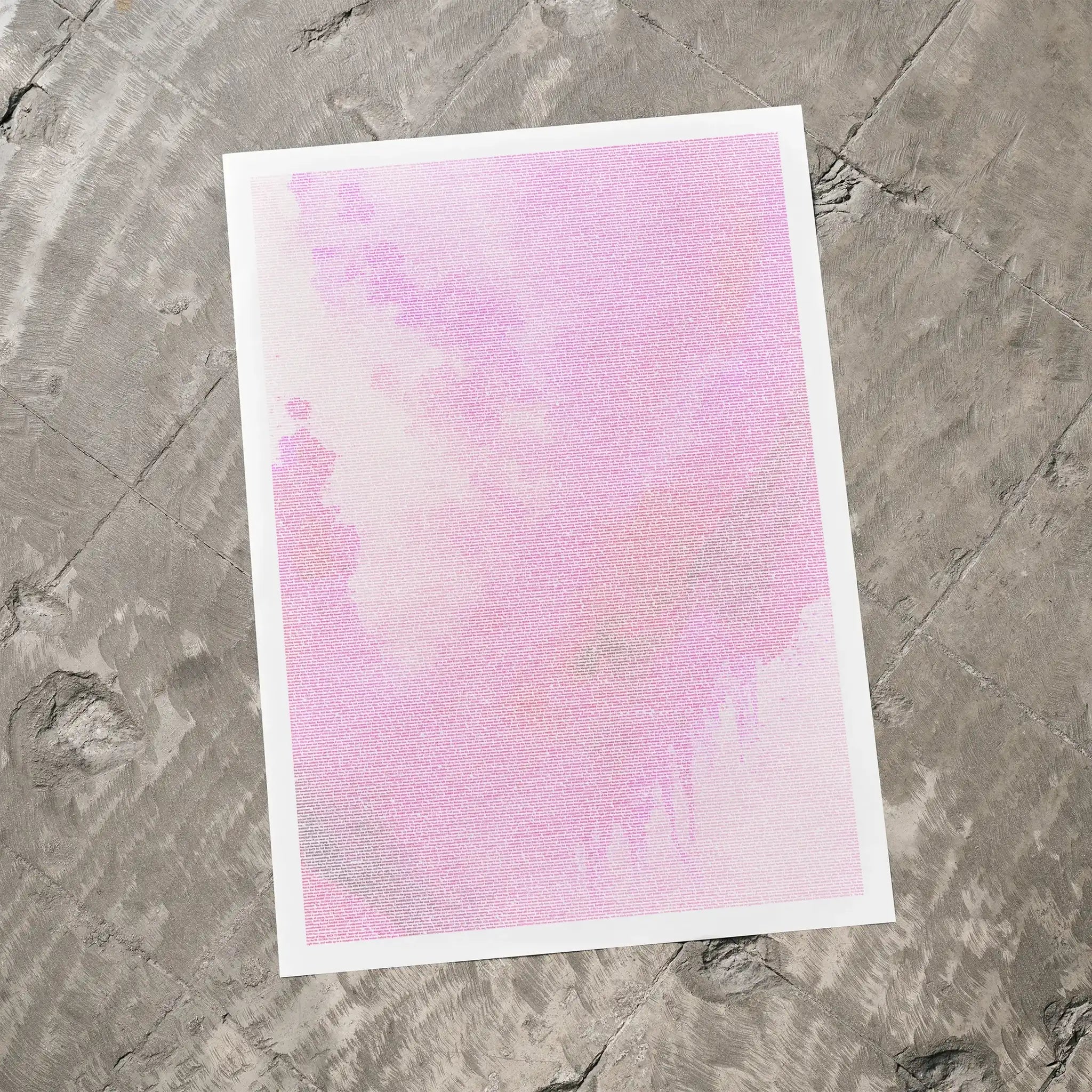 A Barbie movie script poster laid flat on a textured floor surface.