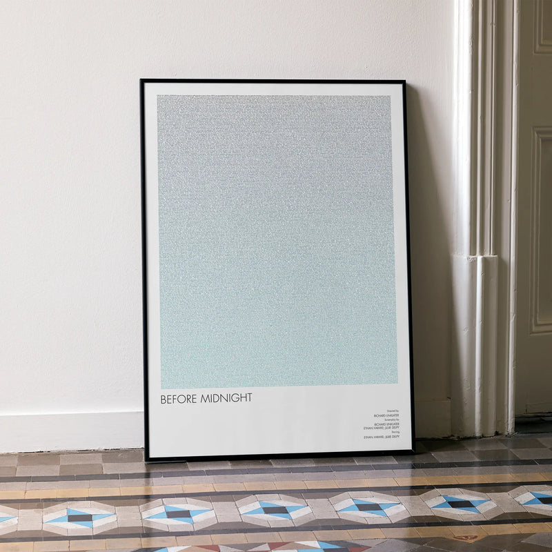 A framed Before Midnight movie script poster leaning against a wall in a minimalist interior.