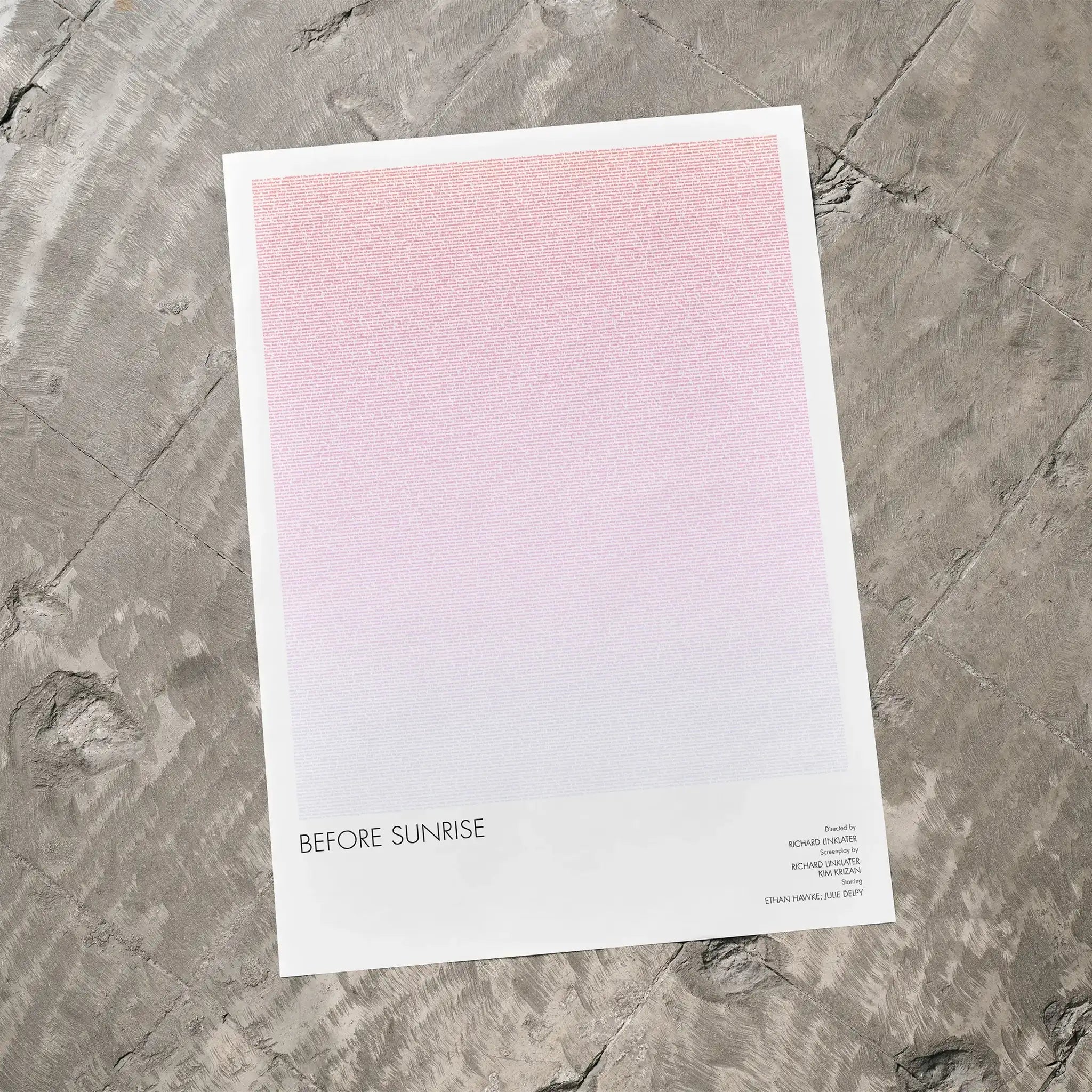 A Before Sunrise movie script poster laid flat on a textured floor surface.