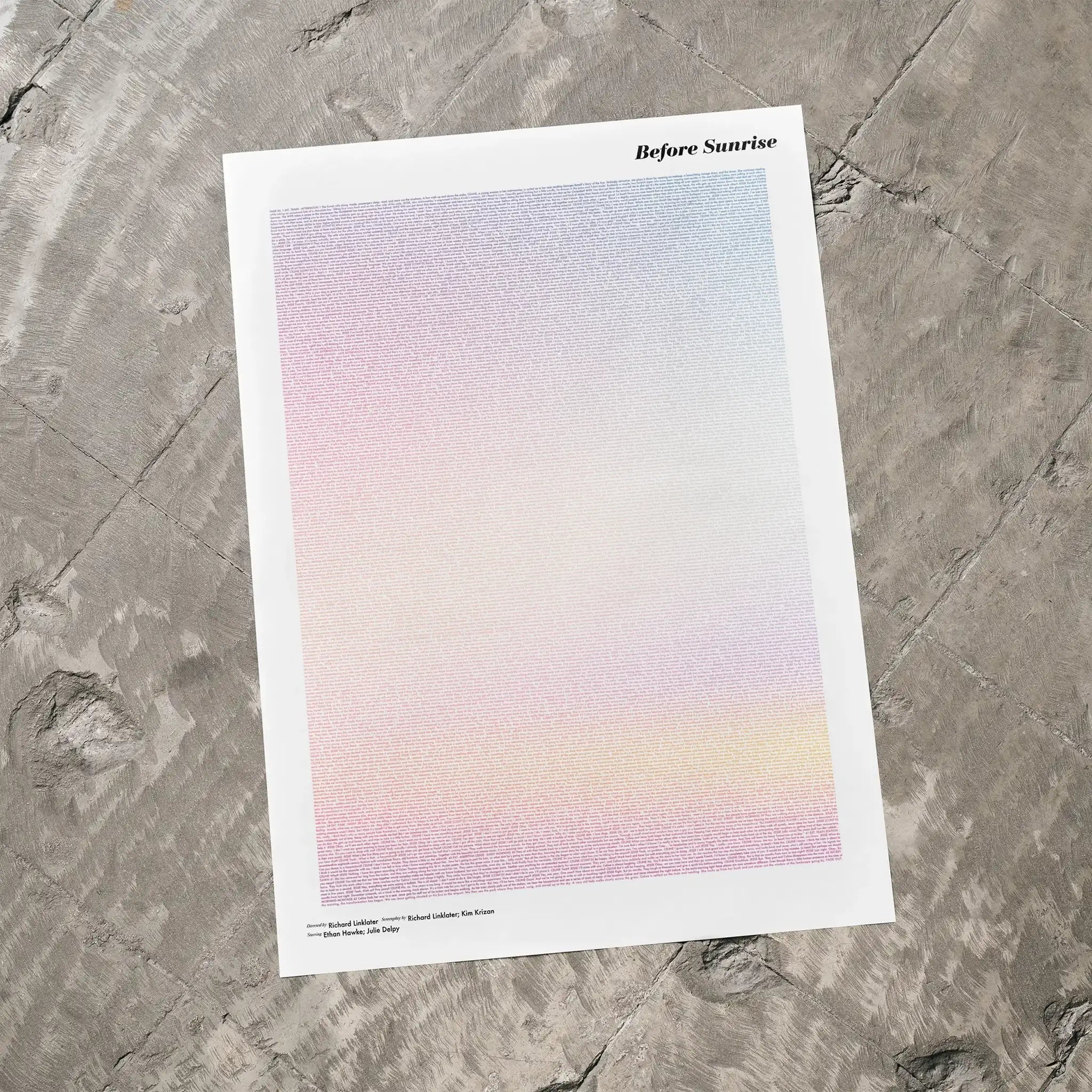 A Before Sunrise movie script poster laid flat on a textured floor surface.