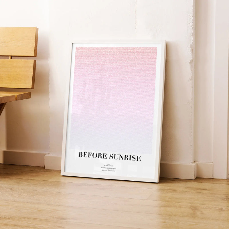 A framed Before Sunrise movie script poster leaning against a wall in a modern interior.