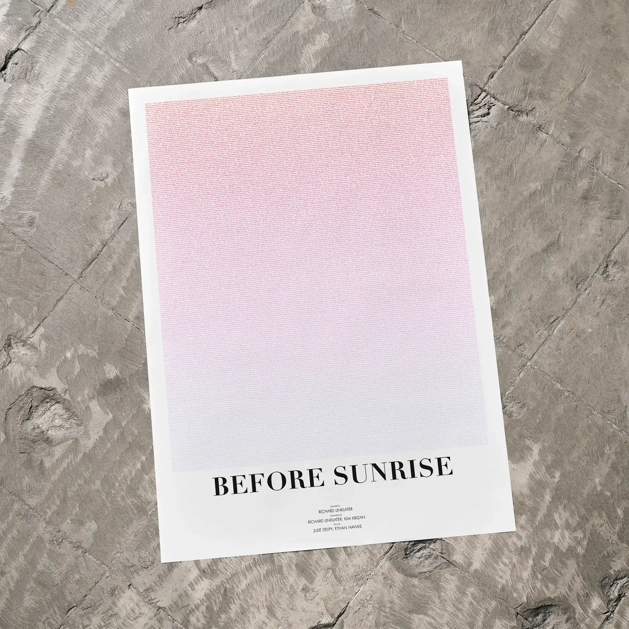 A Before Sunrise movie script poster laid flat on a textured floor surface.