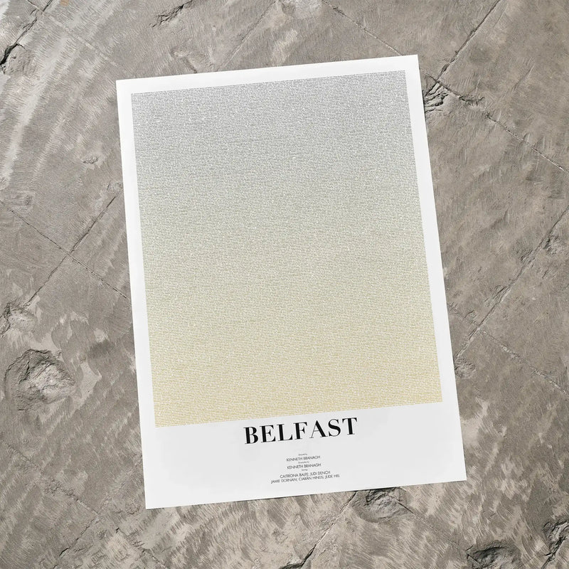 A Belfast movie script poster laid flat on a textured floor surface.
